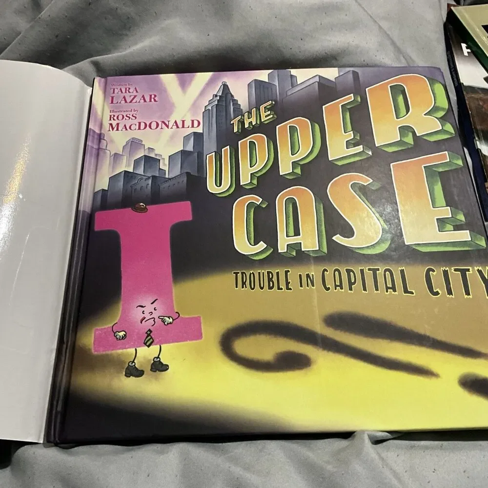 THE UPPER CASE TROUBLE IN CAPITAL CITY HARDCOVER W/ DUST COVER 1ST ED. 2019 NEW
